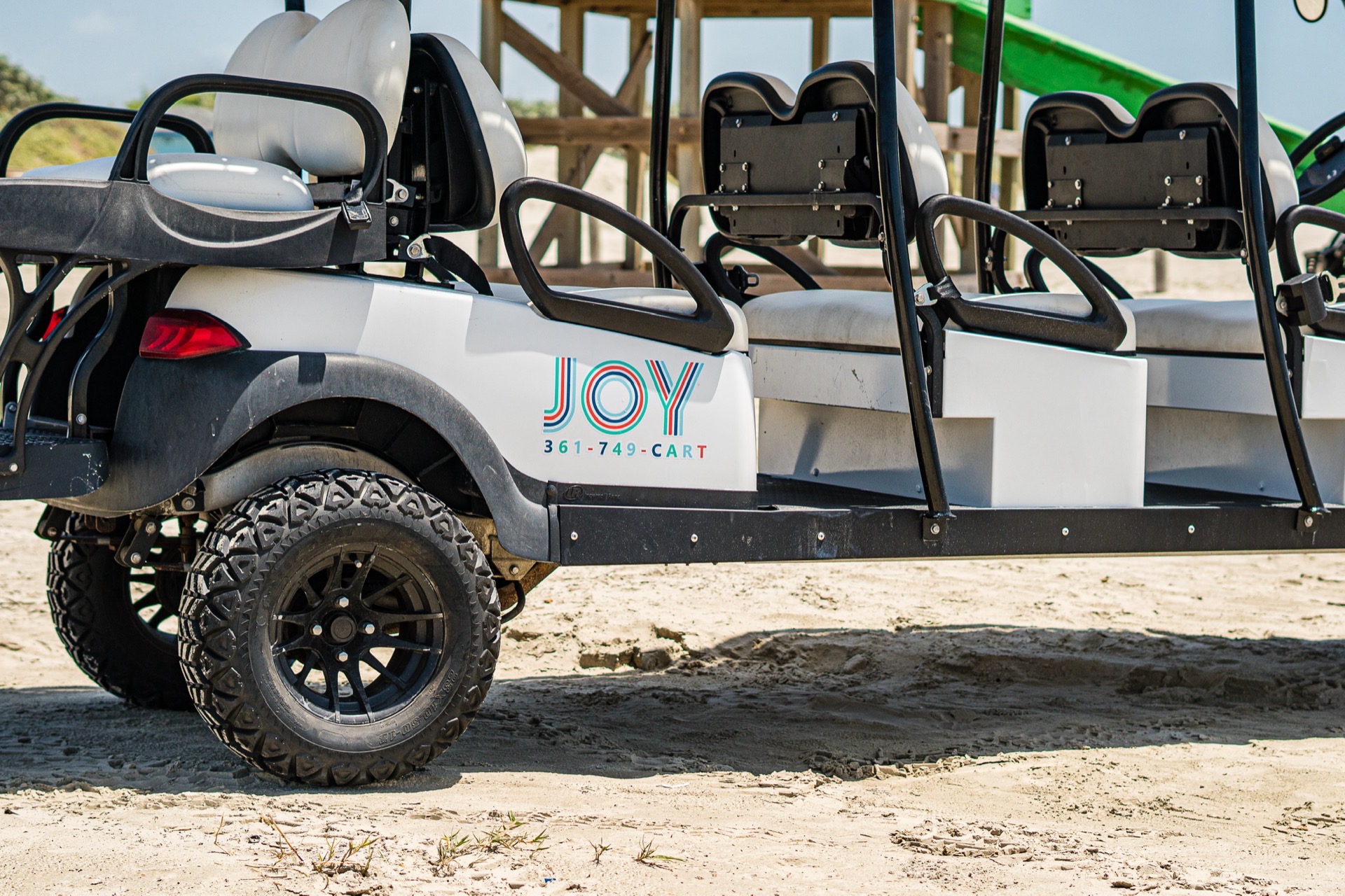 Joy 361-749-CART decal on the side panel of a cart with the dunes behind